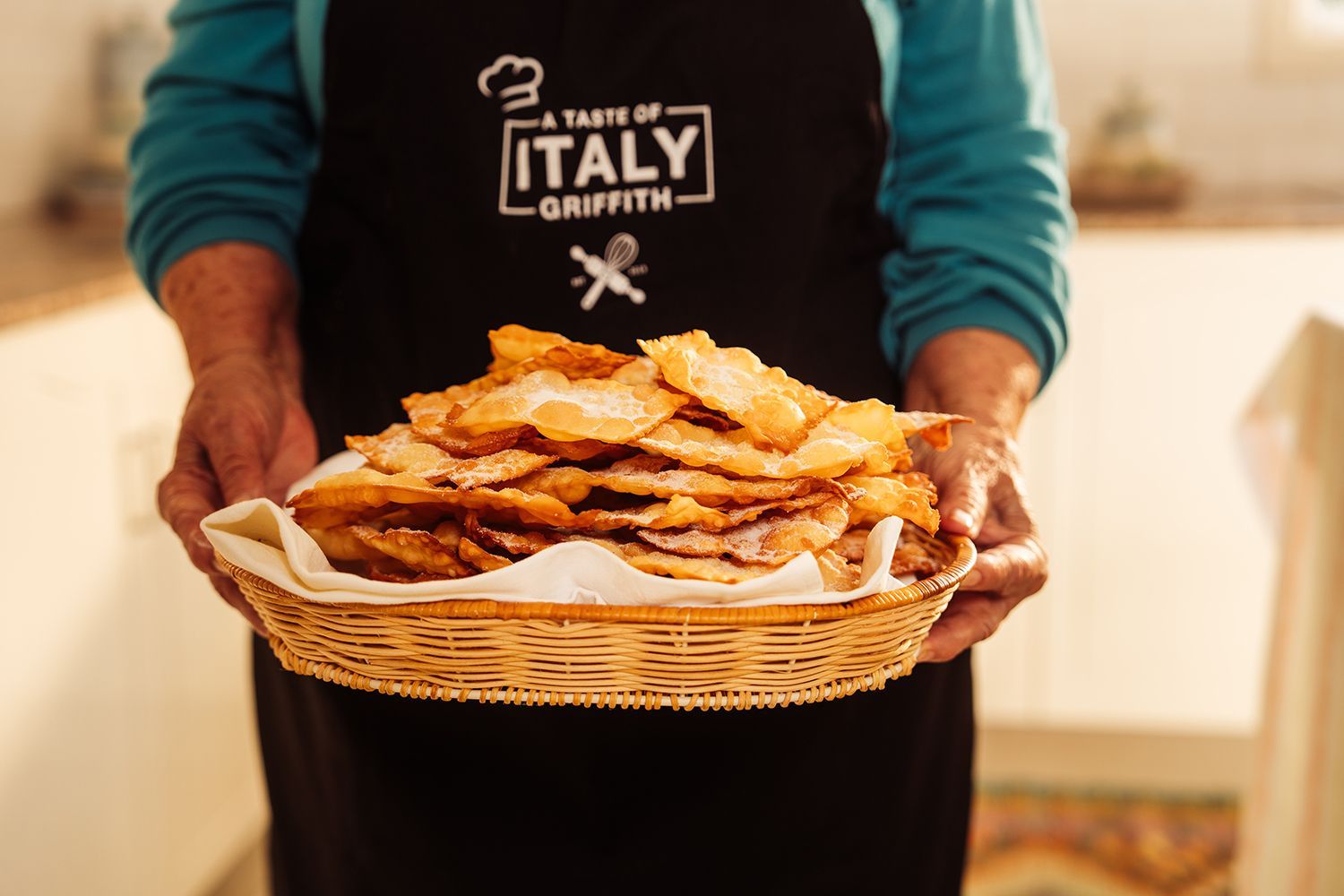 A waiter at Taste of Griffith holding a plate of Italian pasatries